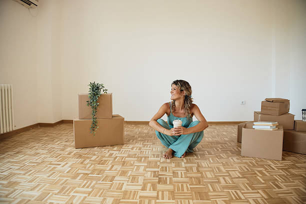 istock Single woman moving into new home 2216471550