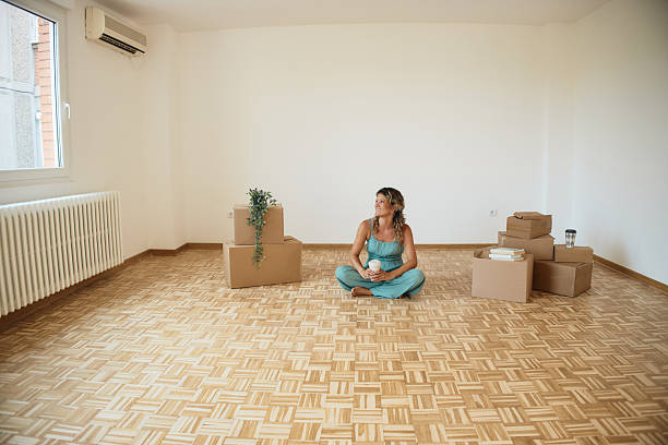 istock Single woman moving into new home 2216471794