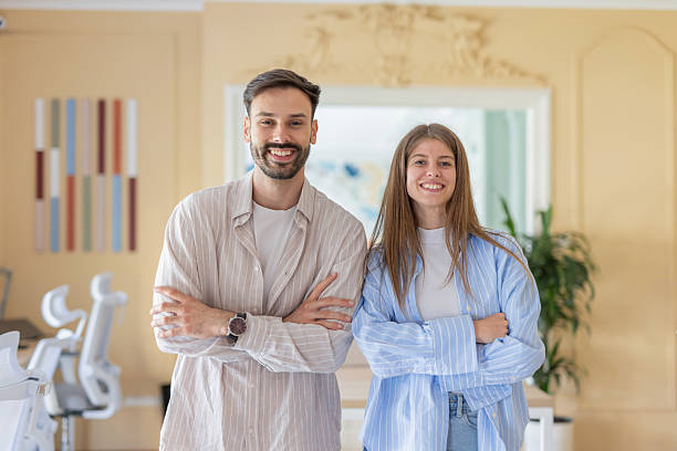 istock Friendly Professionals Posing Together in Modern Office 2216473646