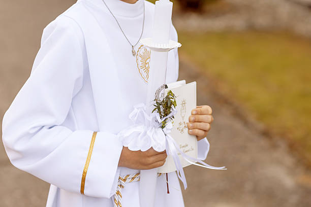 Child Holding First Communion Candle in Traditional White Robe (Alba) – Polish Religious Tradition