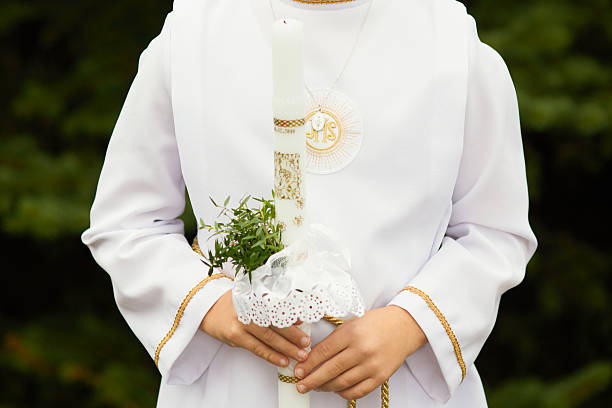 Child Holding First Communion Candle in Traditional White Robe (Alba) – Polish Religious Tradition