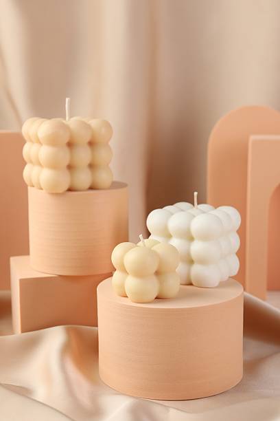 istock Beautiful bubble candles and geometric figures on beige fabric 2216477834