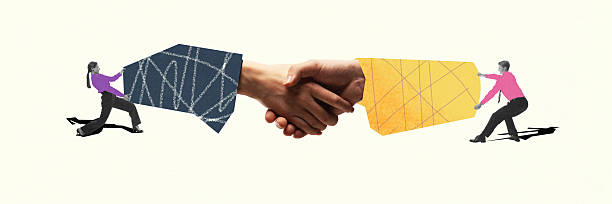 istock Digital artwork. Two business people pull opposite hands into handshake, showing tension and effort to make a deal. 2216480635