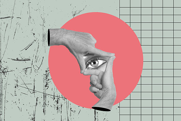 istock Man hands doing photo framing gesture with an eye inside on a pink circle 2216485648