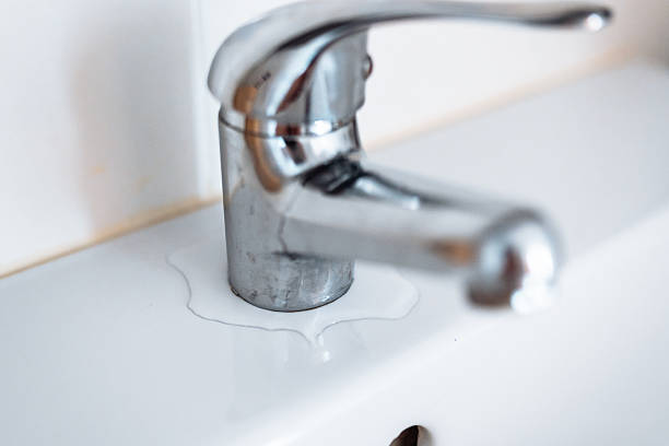 istock plumbing faucet repair 2216486403