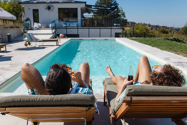 istock Relaxation by a poolside on a sunny day with drinks 2216492229