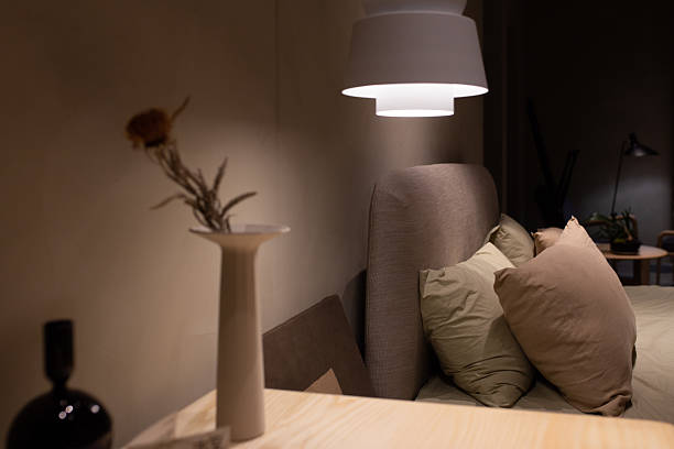istock Cozy bedroom with soft lighting and modern decor 2216495153