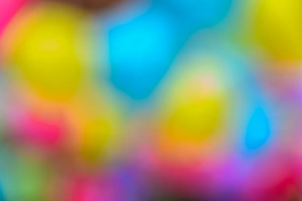 A vivid and colorful abstract background blending bright hues into smooth gradients and soft shapes, evoking an energetic and playful atmosphere.