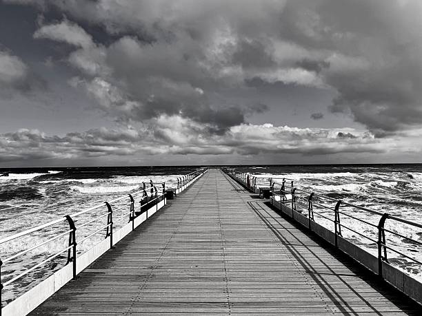 Lake storm waves crashing and splashing against pier, Balaton, Hungary