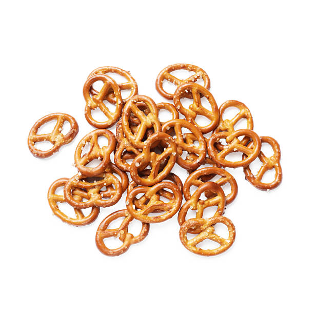 istock Many delicious pretzel crackers isolated on white, top view 2216495797