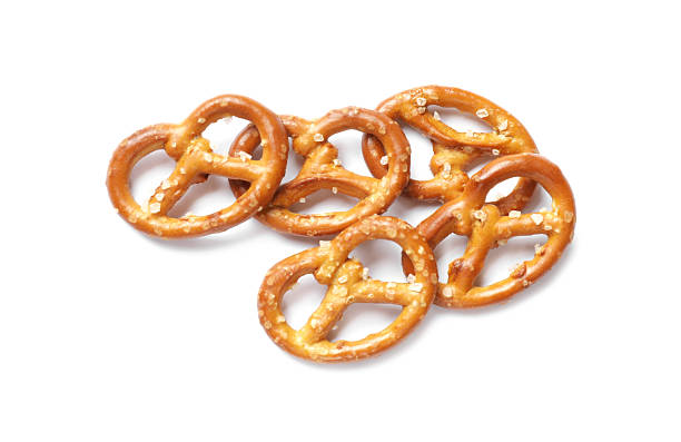 istock Many delicious pretzel crackers isolated on white, top view 2216495825