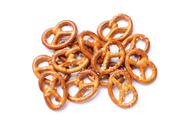 istock Many delicious pretzel crackers isolated on white, top view 2216495831