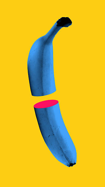 istock Abstract art collage. Floating blue banana split in mid-air with harsh pink slice evokes disruption of natural form through artificial absurdity. 2216496686