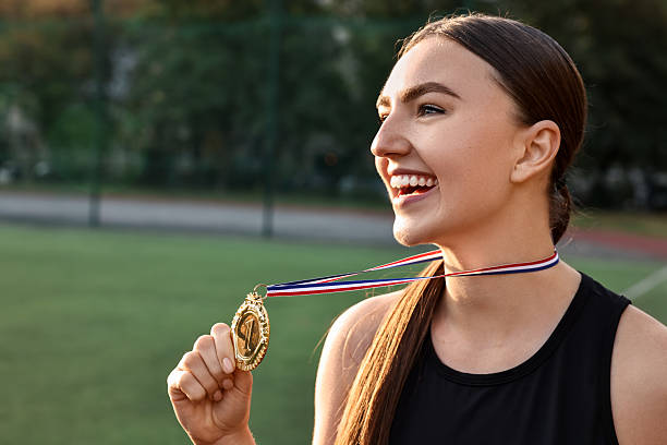 istock Happy winner with golden medal at stadium. Space for text 2216498324
