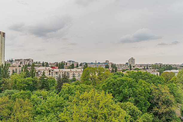 istock Overcast skyscape view from elevation Dense urban greenery, mixed architecture styles, brown, gray, white buildings 2216498803