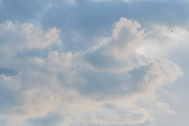 istock Bright, sunny day with scattered fluffy clouds and a deep blue sky No visible objects or people Simple photograph style, focusing on natural beauty 2216499118
