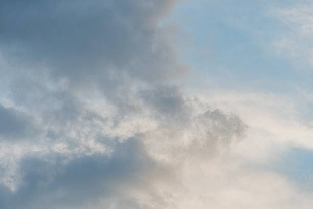 istock Overcast sky with scattered gray and white clouds, contrasting light and shadow patterns Muted color palette dominated by grays No discernible objects or structures Emphasis on realism in naturali 2216499236