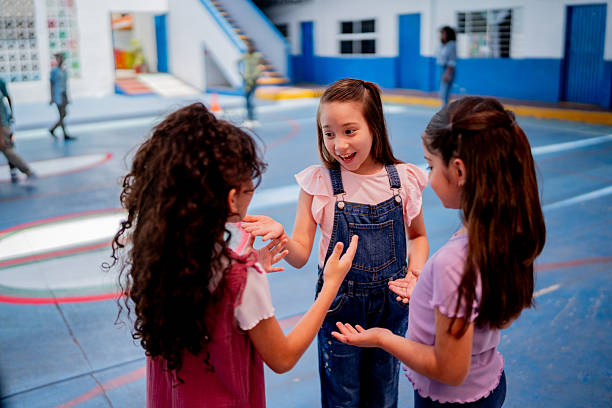 Chil students girls talking and playing at school