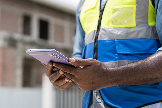 istock Construction site, housing estate and construction engineer working, planning, inspecting structure of architecture in construction site. Hands checking estate projects under construction 2216505397
