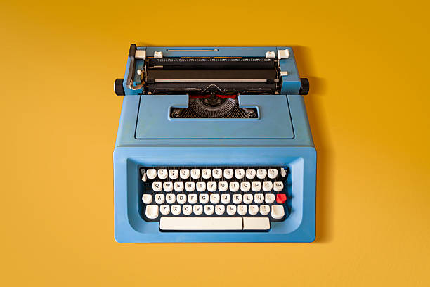 istock Blue Retro Typewriter from the 70s on a Yellow Background. 2216506240
