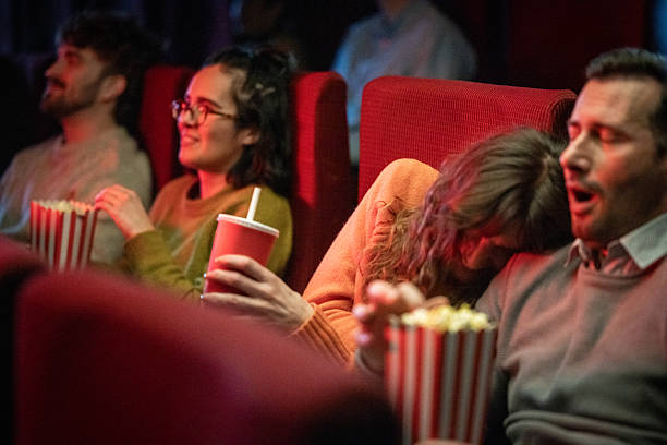 istock Spectators in a theater, enjoying a film with snacks and drinks 2216507771