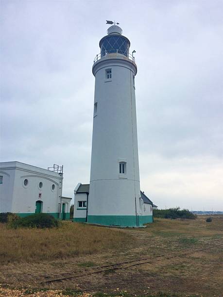 istock Single lighthouse on foggy winters day 2216508575