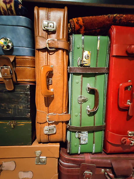 istock different colored vintage suitcases stacked on top of each other 2216510010