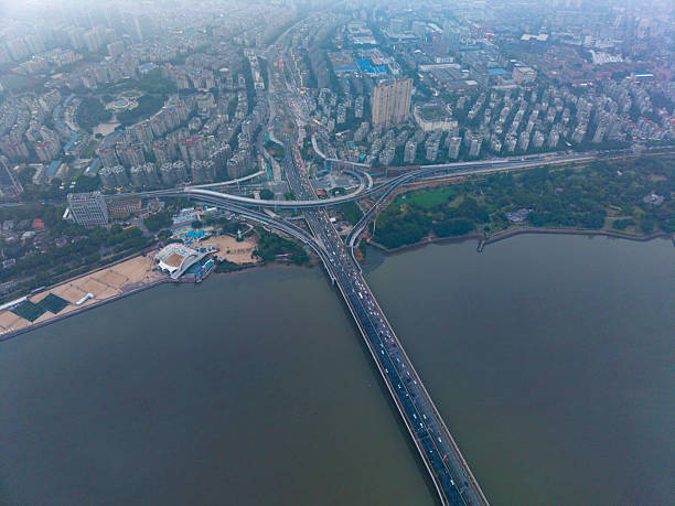 istock Aerial View of a Busy Bridge Over a River 2216510747