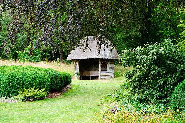 England, Gloucestershire, Cotswolds, Bibury, Cotswold cottages, pretty gardens