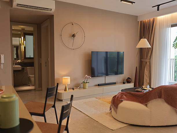 istock Modern Cozy Living Room with Curved Sofa and Warm Natural Light 2216512052