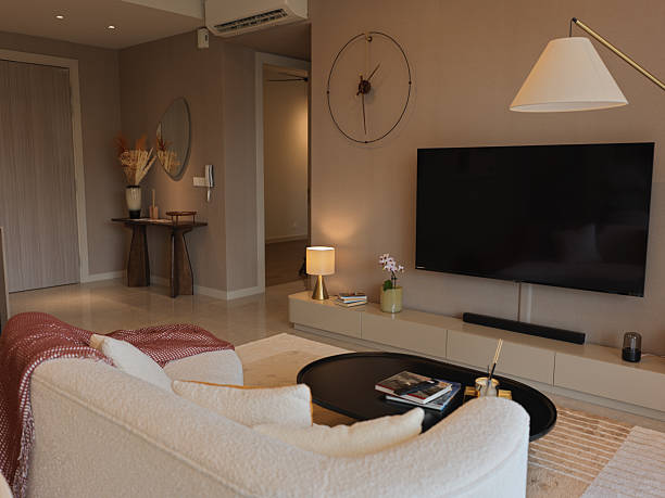istock Modern Cozy Living Room with Curved Sofa and Warm Natural Light 2216512109