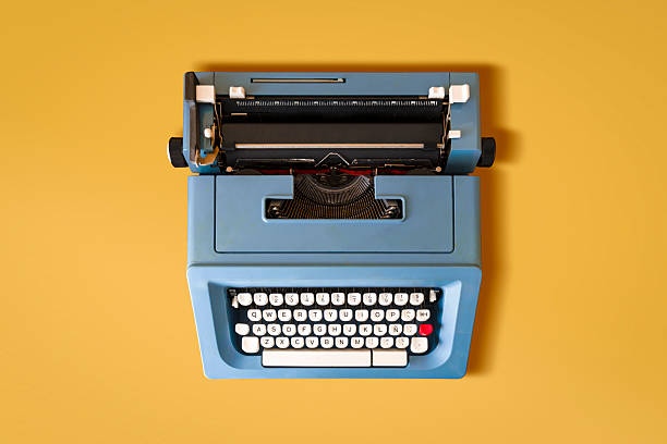 istock Blue Retro Typewriter from the 70s on a Yellow Background. 2216512203