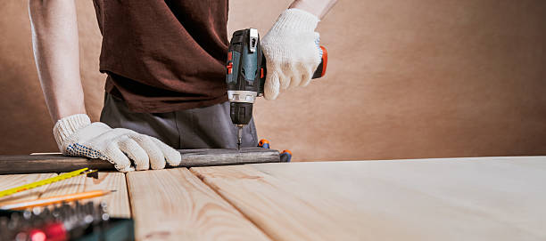 istock Person Drilling Into Wood With Protective Gloves Banner 2216512967