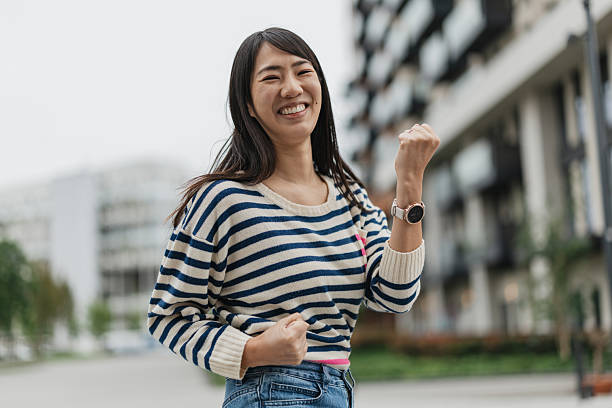 Woman celebrating success with playful gesture