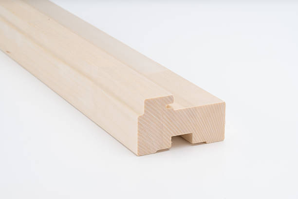 istock Light wood joinery profile block with precise cutouts and grooves, placed on a white background. Ideal for door or window frame construction. 2216514022