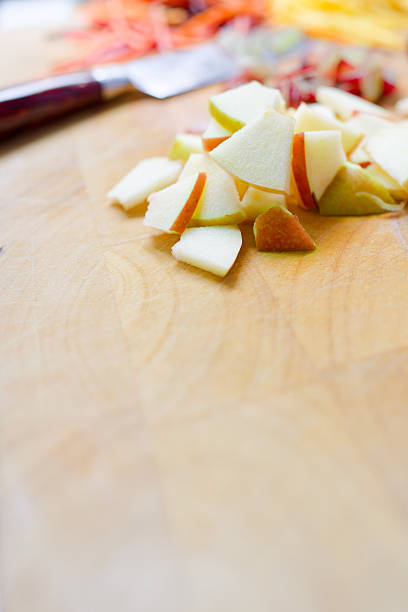 A Close up slicing apple on a chopping board