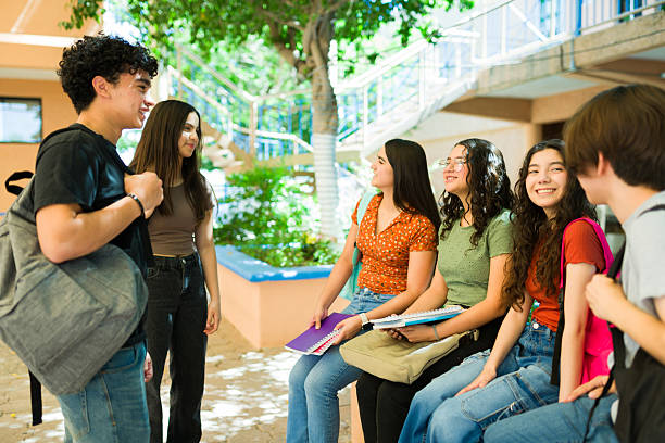 istock Group of  students chatting together on high school campus 2216514887