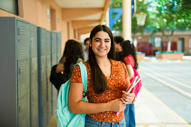 istock Beautiful latin student smiling in high school hallway 2216516414