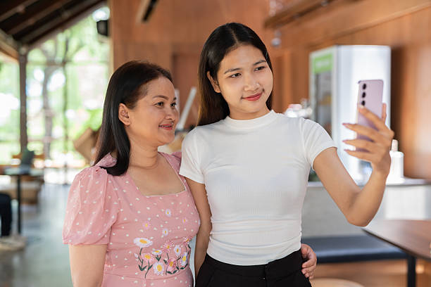 istock Mother and daughter inside cafe 2216516416