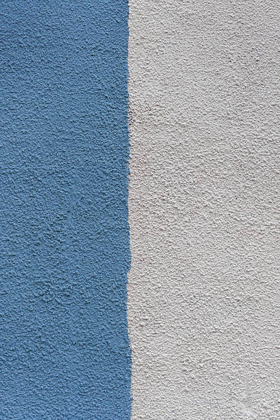 istock A wall with a blue and white stripe is painted on it. 2216516562