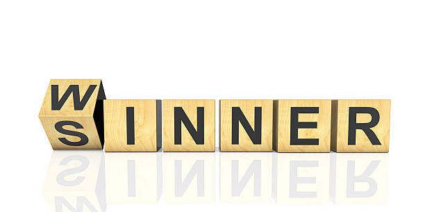 Flipping wooden cubes with word WINNER to SINNER