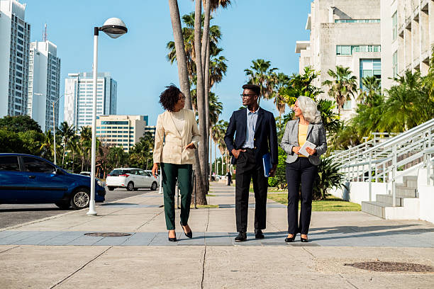 istock Coworkers talking and walking outdoors 2216521237