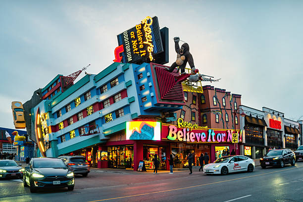 New York City, New York, USA - 07.31.2024: A colorful retro-style statue of a smiling diner waitress holds a tray with a burger and milkshake. The nostalgic display stands outside a classic American diner in New York City.
