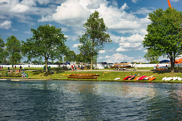 Canoes lying on a canal side grass verge on a spring morning