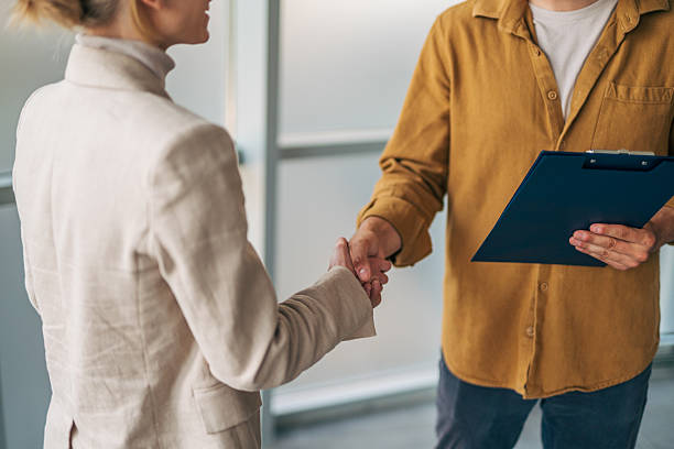 istock Businesspeople shaking hands after signing contract agreement 2216523717