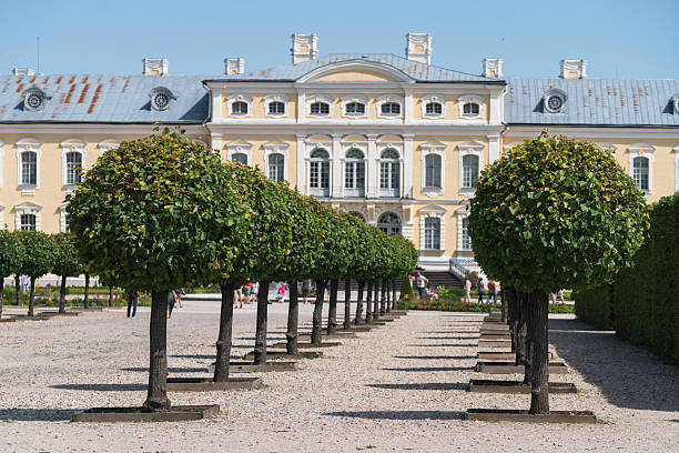 Pilsrundale, Latvia - July 21, 2019: Rundale Palace is the most important Baroque palace in Latvia. In the foreground is the palace garden