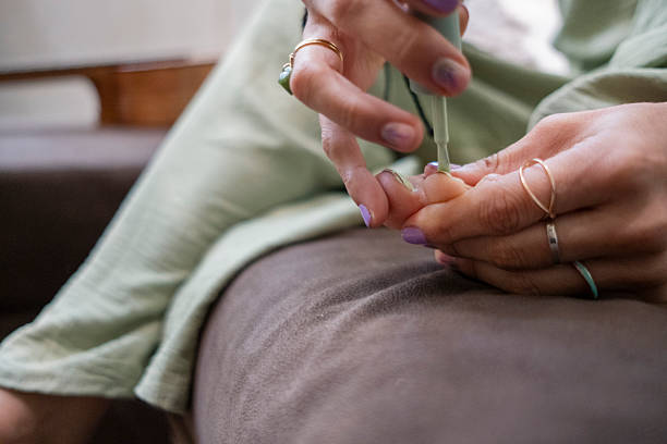 woman painting her nails, manicure