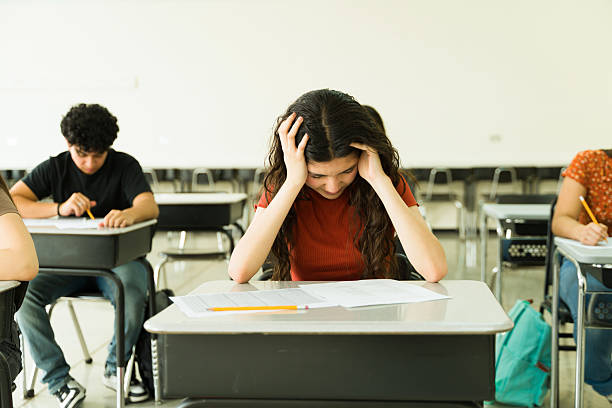 istock Students concentrating on high school admission test 2216530350