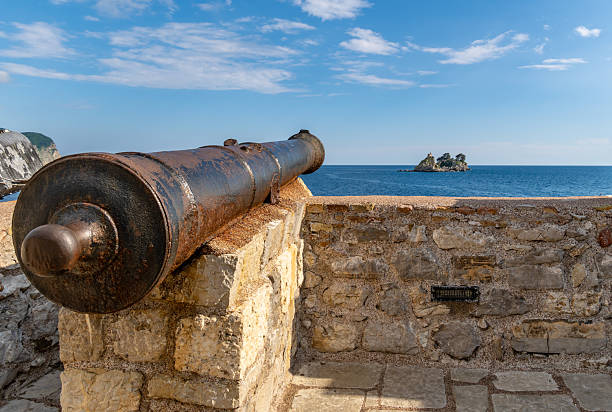 istock Rusty cannon on Petrovac harbour wall in Montenegro 2216530472