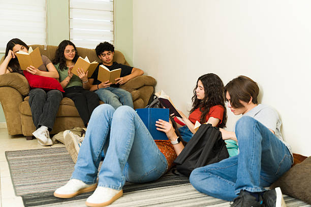 istock Group of students reading comfortable in school library 2216532273